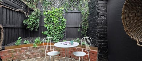 A character courtyard has outdoor seating where you can enjoy your morning coffee or an afternoon wine.