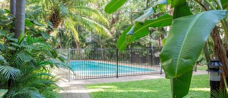 Catch some rays and go for a quick dip in the communal swimming pool surrounded by lush greenery and exotic plants