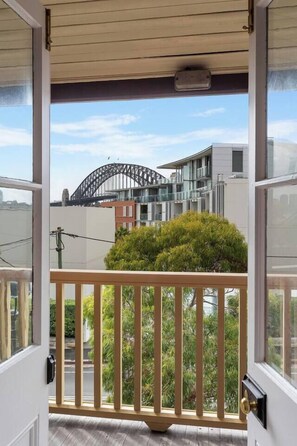 A sleek seating area in the primary bedroom offers beautiful harbour ‎views