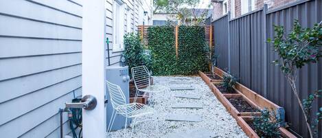 A gorgeous private courtyard privates an idyllic space to enjoy your morning coffee or an afternoon wine.