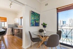 A dining area by the kitchen shares an amazing view with the living room.