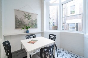 The light and bright sun room offers a dining table where you can sit down to a meal at home or use it as a dedicated workspace for those on business.
