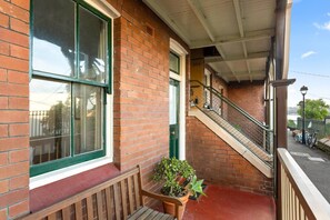 At the entrance to the property is a sunny verandah with a classic teak bench where you can watch the world go by. 
