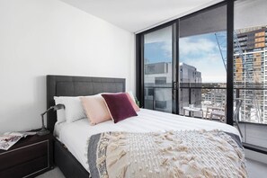 The main bedroom is complete with ensuite and access to the private balcony overlooking South Yarra 