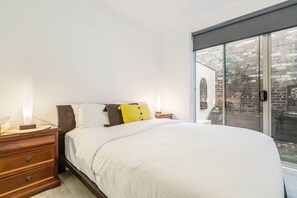 The beautiful bedroom opens to the courtyard and comes set with a comfortable queen-sized bed. 
