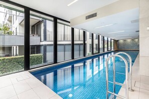 The building's shared amenities include a generous indoor pool.
