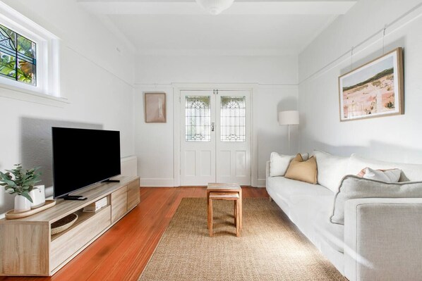 The living area is elegantly styled with comfortable furniture and modern finishes. Relax on the lounge and enjoy a spot of TV in the evening.