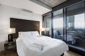 The bedroom has a direct access to the balcony and is equipped with black out blinds.