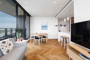 The light-filled living and dining area flows to a beautiful balcony with sweeping views across Albert Park Lake.