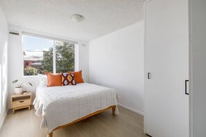  The first bedroom has a leafy outlook and comes with a built-in wardrobe for storing your belongings.
