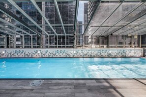 Take a dip in the residents’ glistening swimming pool with outlooks across the city skyline.
