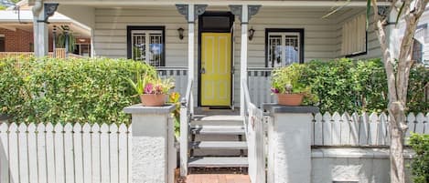 The entrance to this free standing terrace boasts a colourful yellow door—reflective of the bright decor inside.