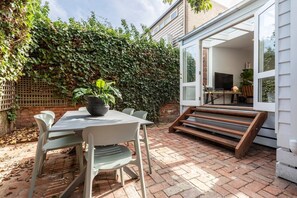 Kick back and relax in the sunny courtyard. This is an idyllic space to enjoy your morning coffee or alfresco meal.