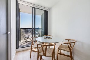 This dining table seats four, with views overlooking Parkville from the step-out balcony
