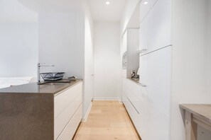 The compact kitchen comes with everything you’ll need to prepare meals at home, including an oven, fridge and microwave.
