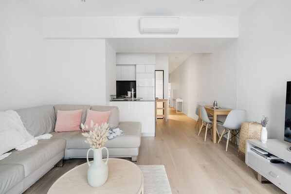 Get cosy within the lounge room, with a central TV catering to your evening entertainment.