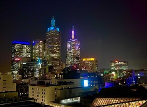 Perched on the 14th floor, this renovated space offers captivating city skyline views. The scene truly comes alive at night, adorned with the captivating glow of city lights.