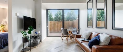 The light-filled living area flows straight to the patio creating a beautiful transition with the outdoors.
