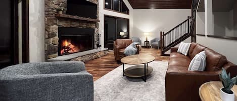 Great room with large wood burning fireplace.