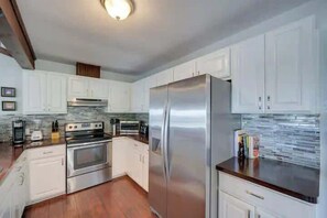 This open kitchen design is perfect for the chef in your group. Fully stocked kitchen includes all the appliances you need, a full-size refrigerator and plenty of counter space.