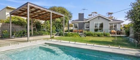 The ultimate garden setting with a glistening solar-heated swimming pool