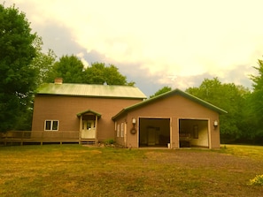 Front of house with porch and attached garage   Gas grill snowblower stored here