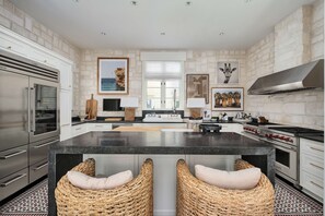 The kitchen is well supplied with high-end appliances