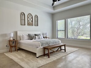 Downstairs bedroom 1 with king size bed and ensuite bathroom overlooks the lake