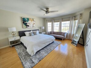 Cozy and comfortable master bedroom with king bed, a futon for additional sleep, a large closet and a TV