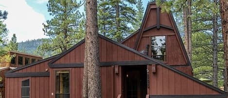 Front of cabin, nestled within beautiful pines