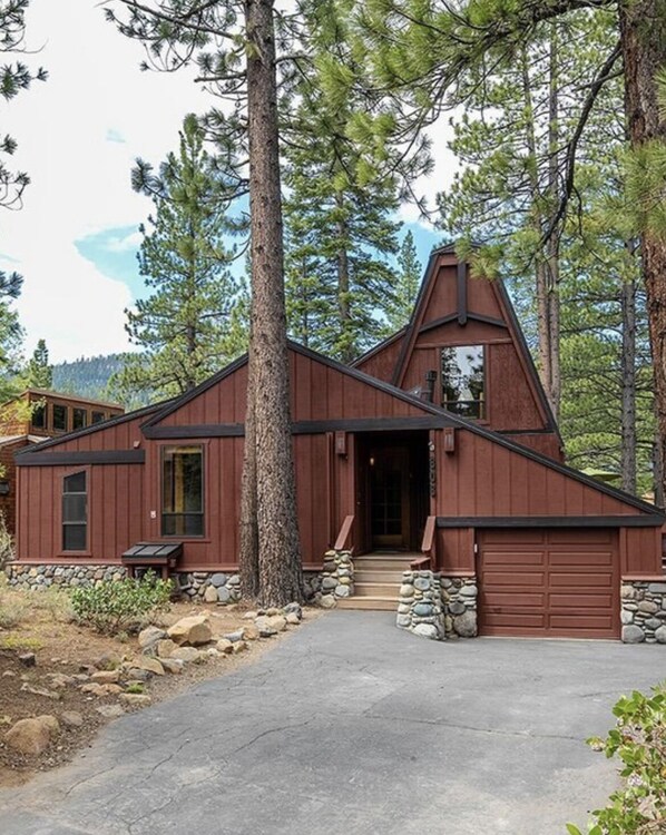 Front of cabin, nestled within beautiful pines