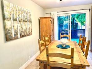 Dining area seats up to 6 people. Can squeeze to seat 8 if add chairs or stools at the ends of the table. Workstation right beside ideal to hook up to monitor. Barbecue right out back on private deck.
Bright lighting above dining table.