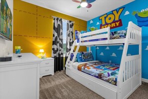 Embark on a playful journey in our Toy Story-themed kids' room, where Woody awaits for endless fun and adventure. Complete with a TV, it's a haven for young imaginations!