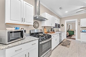 Kitchen with granite countertops and stainless appliances