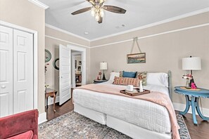 Primary bedroom with king bed and smart tv