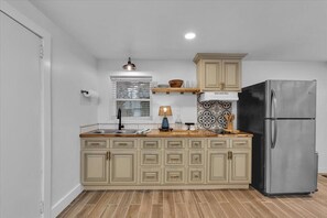 Fully stocked kitchen with refrigerator/ freezer 