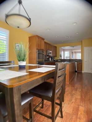 Gather around the dining table for six in a sun-soaked space