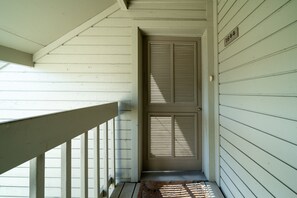 A door leads onto the front deck