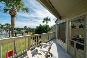 The front deck has two Adirondack chairs