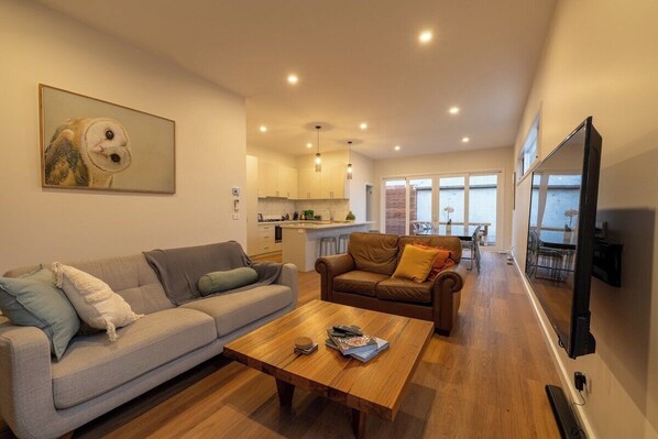 Lounge room with flat screen TV and ample seating
