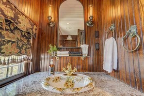 Discover the recently renovated bathroom, which features a gorgeously tiled shower.