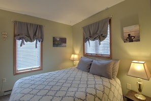 Comfy queen bed in a cozy, calming space.