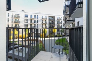 Balcony with a nice view of the trees.