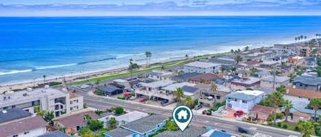 Located one block from the beach, a great surf break and dining