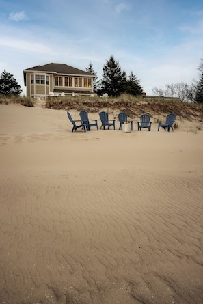 Enjoy evenings on the beach with a SOLO firepit and Adirondack chairs!