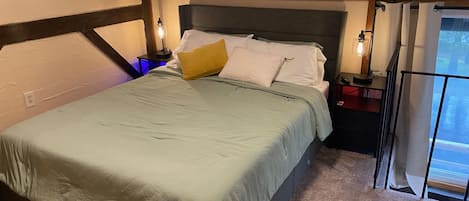 Upstairs bedroom with queen bed, nightstands with charging stations