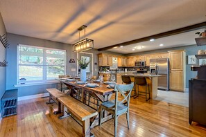 Gather your loved ones around the spacious dining table, where laughter flows as easily as the mountain air, and prepare meals in your fully-equipped kitchen for unforgettable moments together