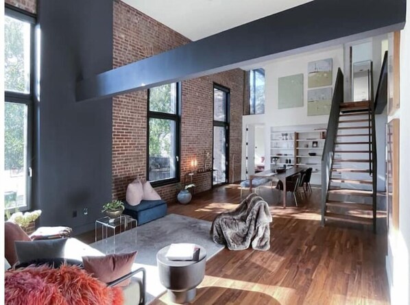 open living/dining area with direct access to private terrace