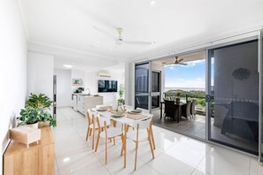 The dining room opens to the balcony, creating a beautiful transition with the outdoors.
