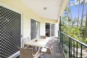 A balcony at the rear of the apartment overlooks the lush greenery that leads into the Botanic Gardens.